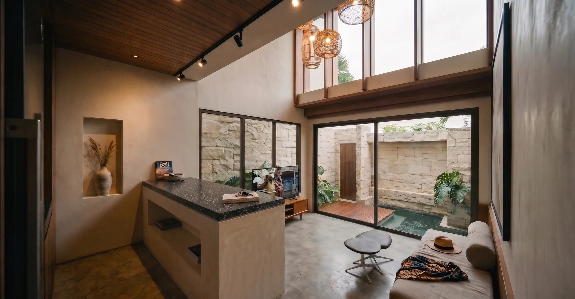 Double-height living room opening to the garden